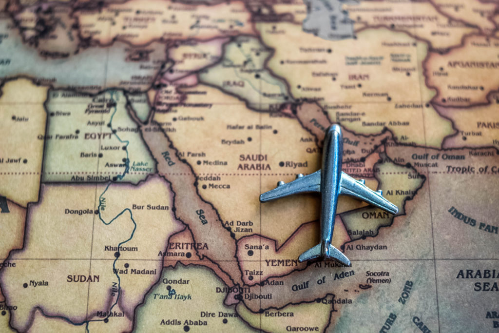 Plane model on Saudi Arabia part of world map.