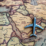 Plane model on Saudi Arabia part of world map.